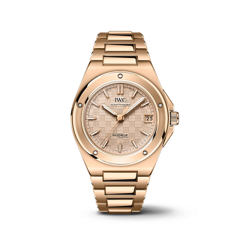 The IWC Schaffhausen Ingenieur Automatic 35 is a gold luxury wristwatch inspired by Gérald Genta, with a linked bracelet, round bezel, patterned dial, date window at 3 o’clock, and simple hour markers—showcasing timeless elegance.