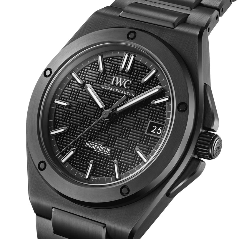 A close-up of the IWC Schaffhausen Ingenieur Automatic 42, featuring a black textured dial, Super-LumiNova white markers, date at 3 o’clock, and a stainless steel bracelet.