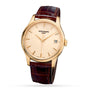 Patek Philippe Calatrava 5227R-001 wristwatch featuring a gold case, brown leather strap, beige dial, and date display at 3 o’clock.