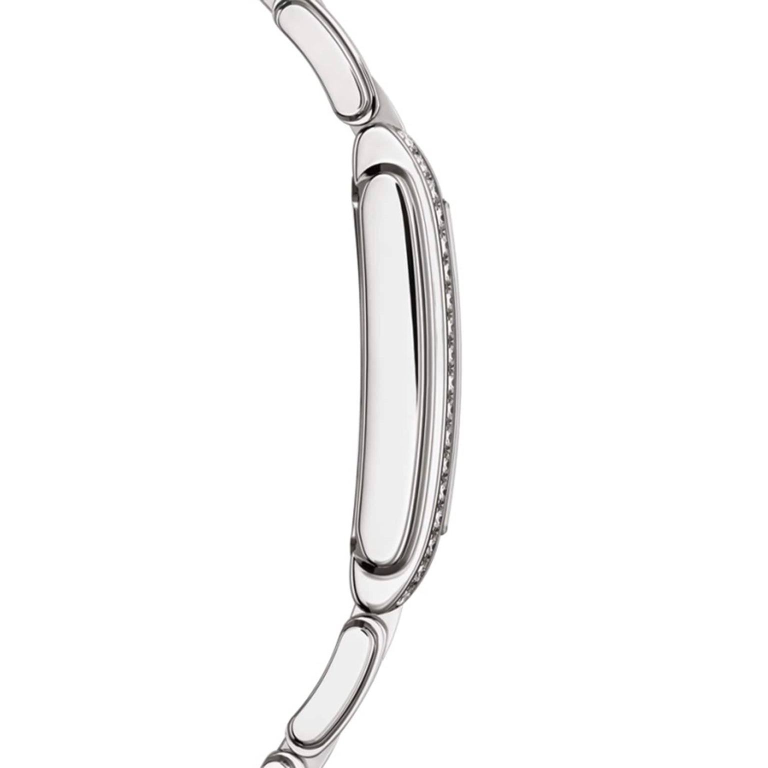 Side view of the Patek Philippe Twenty~4 4910/1200A-001, a sleek silver wristwatch featuring a slim case and metal link bracelet.