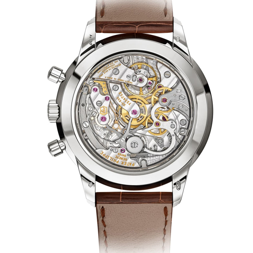 Close-up of the Patek Philippe Complication 5172G-010’s transparent case back, revealing its intricate mechanical movement and gears.