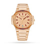 The Patek Philippe Nautilus 7118/1300R-001 is a gold watch featuring a red gemstone bezel and red hour markers, paired with a metal bracelet.