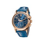 The Patek Philippe Complications 5905R-010 is a luxury watch featuring a blue dial, gold case, and blue leather strap.