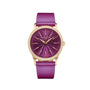The Patek Philippe Calatrava 4997/200R-001 features a gold case, purple dial, diamond bezel, and a matching purple strap, shown on a white background.