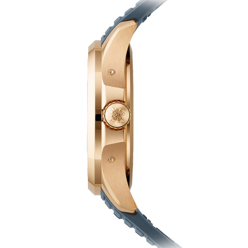 Side view of the Patek Philippe Aquanaut 5261R-001, a gold wristwatch featuring a blue strap and an ornate crown design.