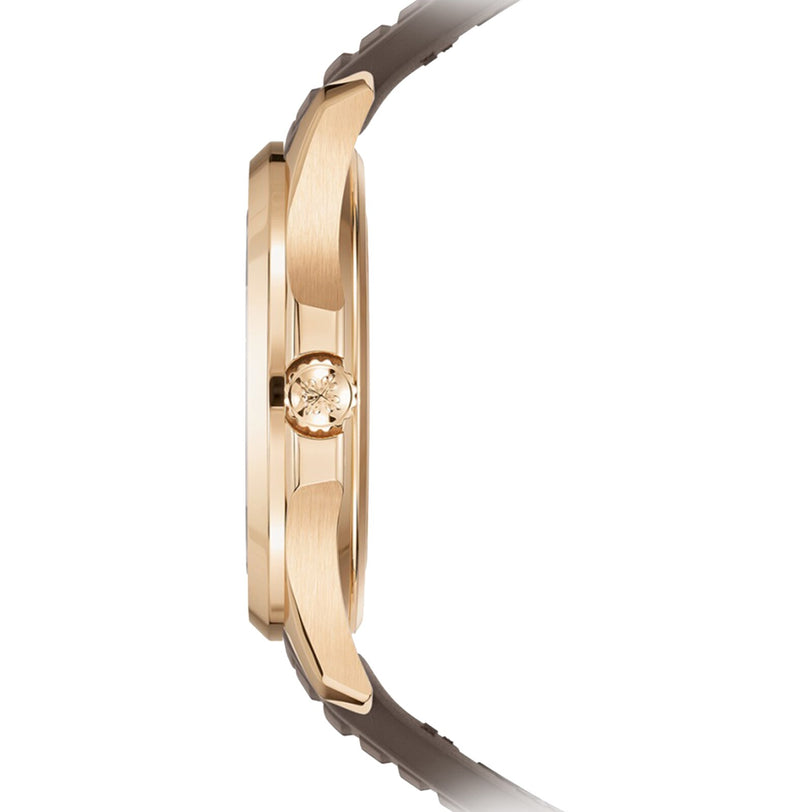Side view of the Patek Philippe Aquanaut 5268/200R-010 gold wristwatch featuring a brown strap and a textured crown.