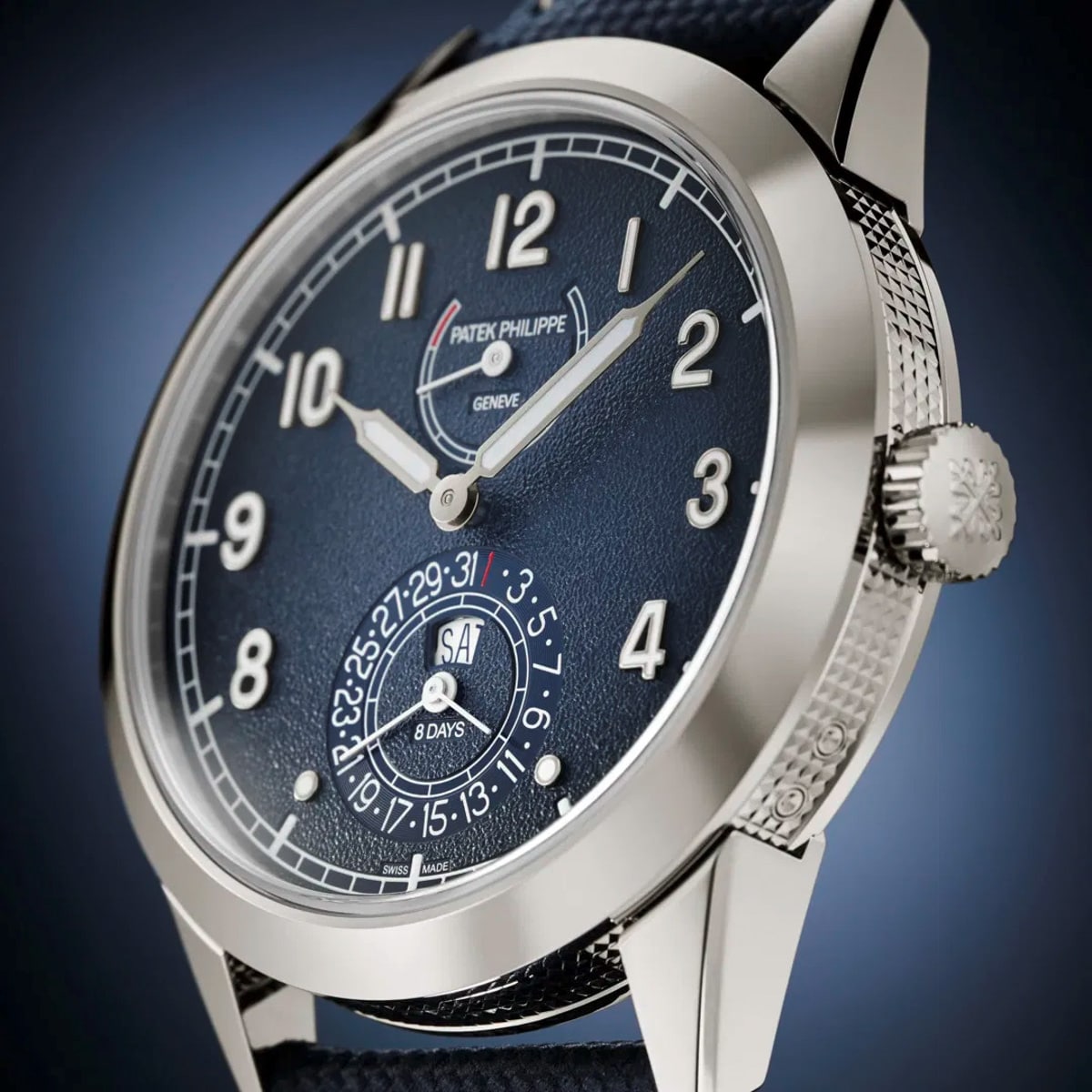 Close-up of the Patek Philippe Complications 5328G-001, a luxury wristwatch featuring a blue dial and silver numerals.
