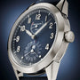 Close-up of the Patek Philippe Complications 5328G-001, a luxury wristwatch featuring a blue dial and silver numerals.