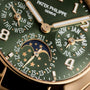 Close-up of the Patek Philippe Twenty~4 7340/1R-010 watch face featuring calendar and moon phase displays.