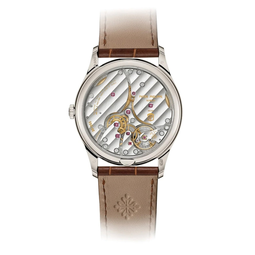 The Patek Philippe Calatrava Platinum 6196P-001 is a luxury watch with a brown leather strap and an exposed mechanical movement on its back.