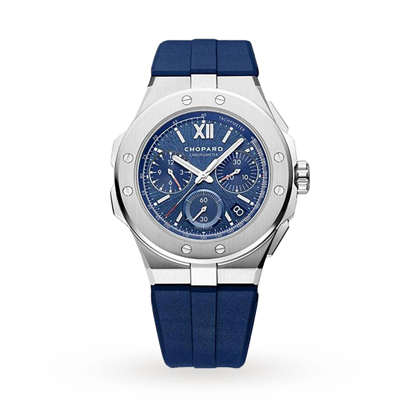 The Chopard Alpine Eagle XL Chrono, a silver wristwatch with blue dial, chronograph subdials, Roman numeral XII, and blue rubber strap, exemplifies Swiss craftsmanship on a white background.