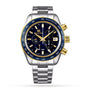 The Grand Seiko Spring Drive Chronograph Sport watch features an 18k yellow gold and blue bezel, silver and gold accents, and a stainless steel bracelet, all shown on a white background.