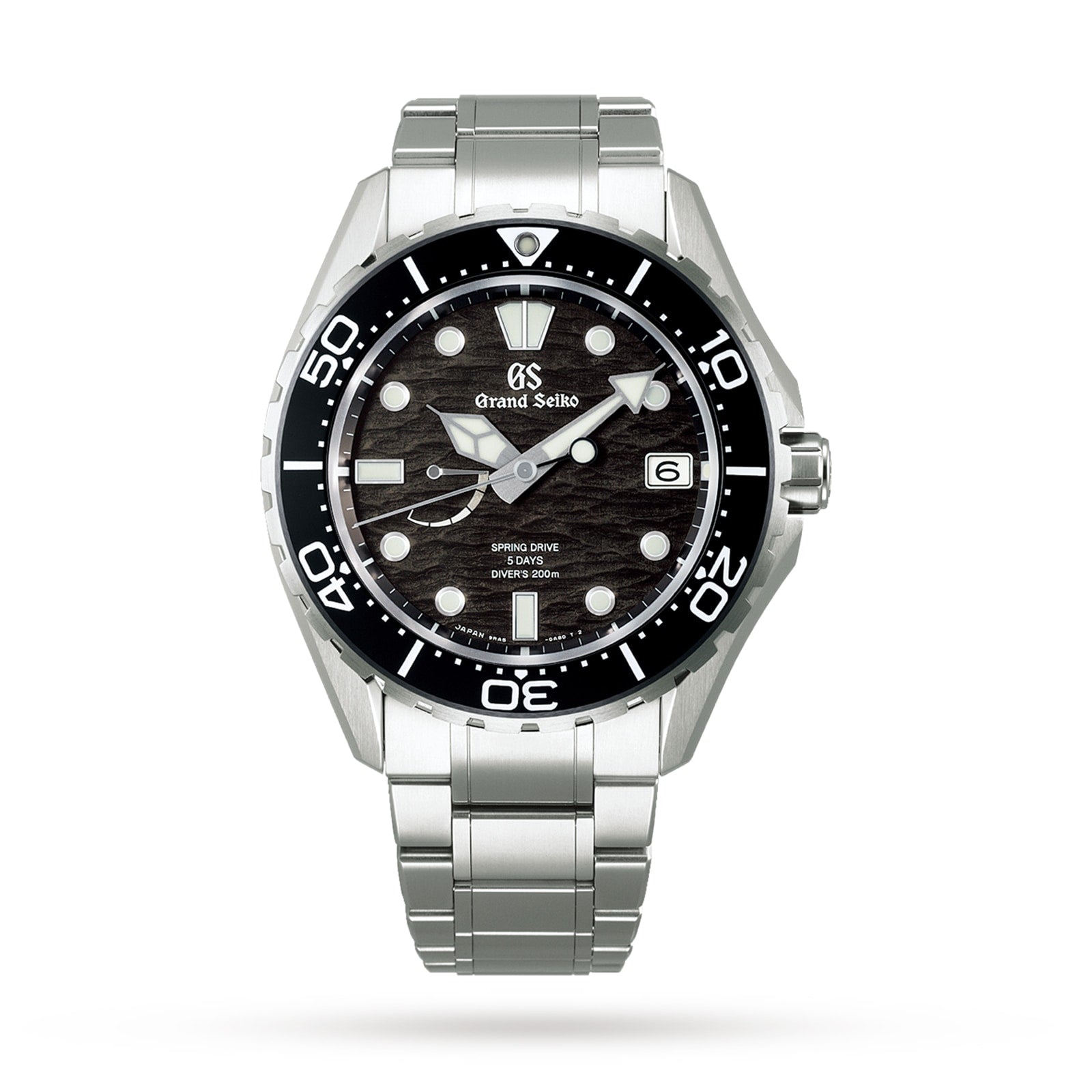 The Grand Seiko Spring Drive GMT Evolution 9 features a textured black dial inspired by Japanese nature, bold white hour markers, date at 3 o’clock, black unidirectional bezel, and stainless steel bracelet.