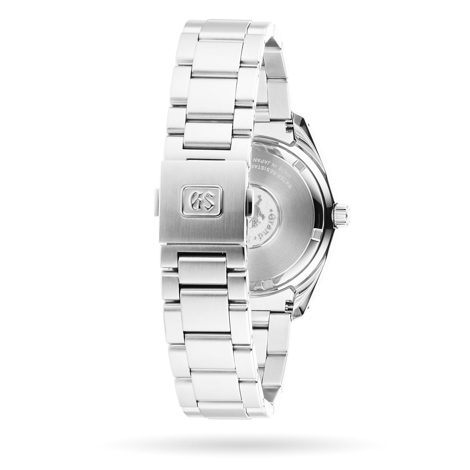 A Grand Seiko Quartz Heritage stainless steel watch, shown from the back, highlights the engraved clasp logo and detailed case back on its metal bracelet band.