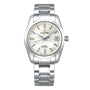 The Grand Seiko Hi-Beat Heritage is a stainless steel wristwatch with a silver textured dial, silver hour markers, date at three oclock, 9S85 automatic movement, and a metal link bracelet.