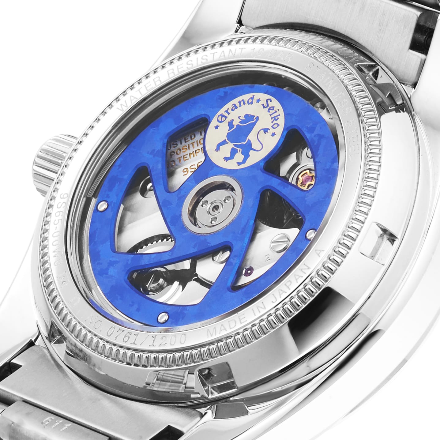 Close-up of a Grand Seiko Automatic Heritage case back showcasing the movement, blue rotor, engraved lion logo, MADE IN JAPAN text, and 25th anniversary limited edition number 0761/1200.