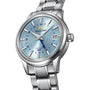 The Grand Seiko Automatic GMT Elegance features a stainless steel case, light blue dial, date at 3 o’clock, and Calibre 9S66 automatic movement on a silver bracelet.
