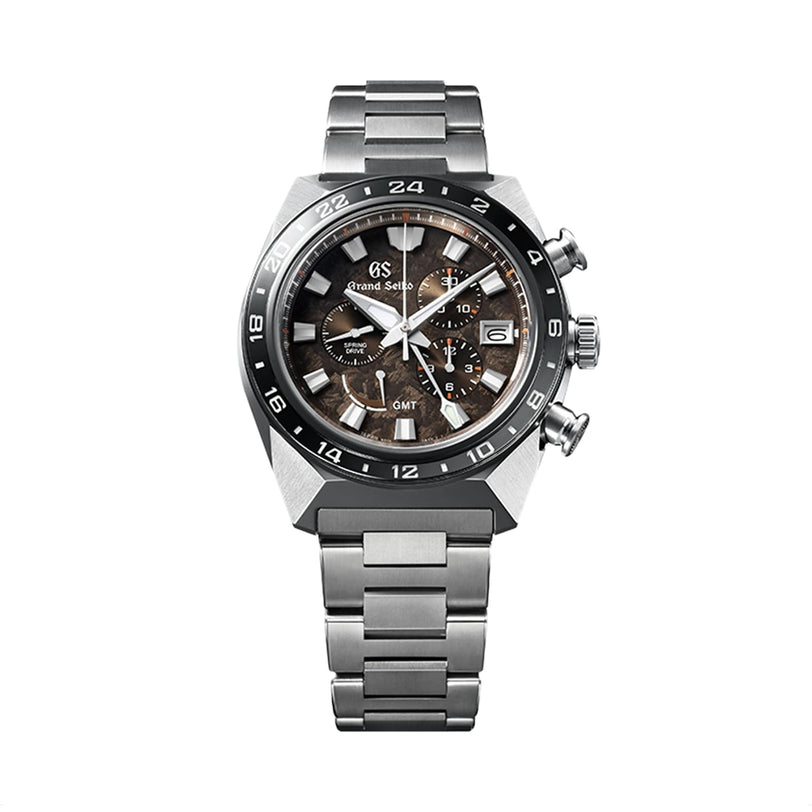 The Grand Seiko Spring Drive Chronograph Sport features a stainless steel case, black and brown dial with three sub-dials, date window, and metal bracelet—exemplifying Japanese precision craftsmanship.