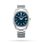 The Grand Seiko Quartz Heritage is a silver stainless steel wristwatch featuring a blue dial, Zaratsu-polished surfaces, silver hour markers, and a date display at 3 o’clock.