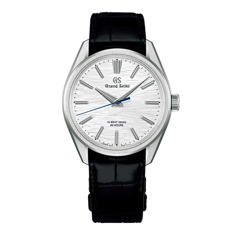 The Grand Seiko Manual Hi-beat 80 Hours Evolution 9 wristwatch features a silver textured dial inspired by white birch bark, silver indices, and a black leather strap, shown against a white background.