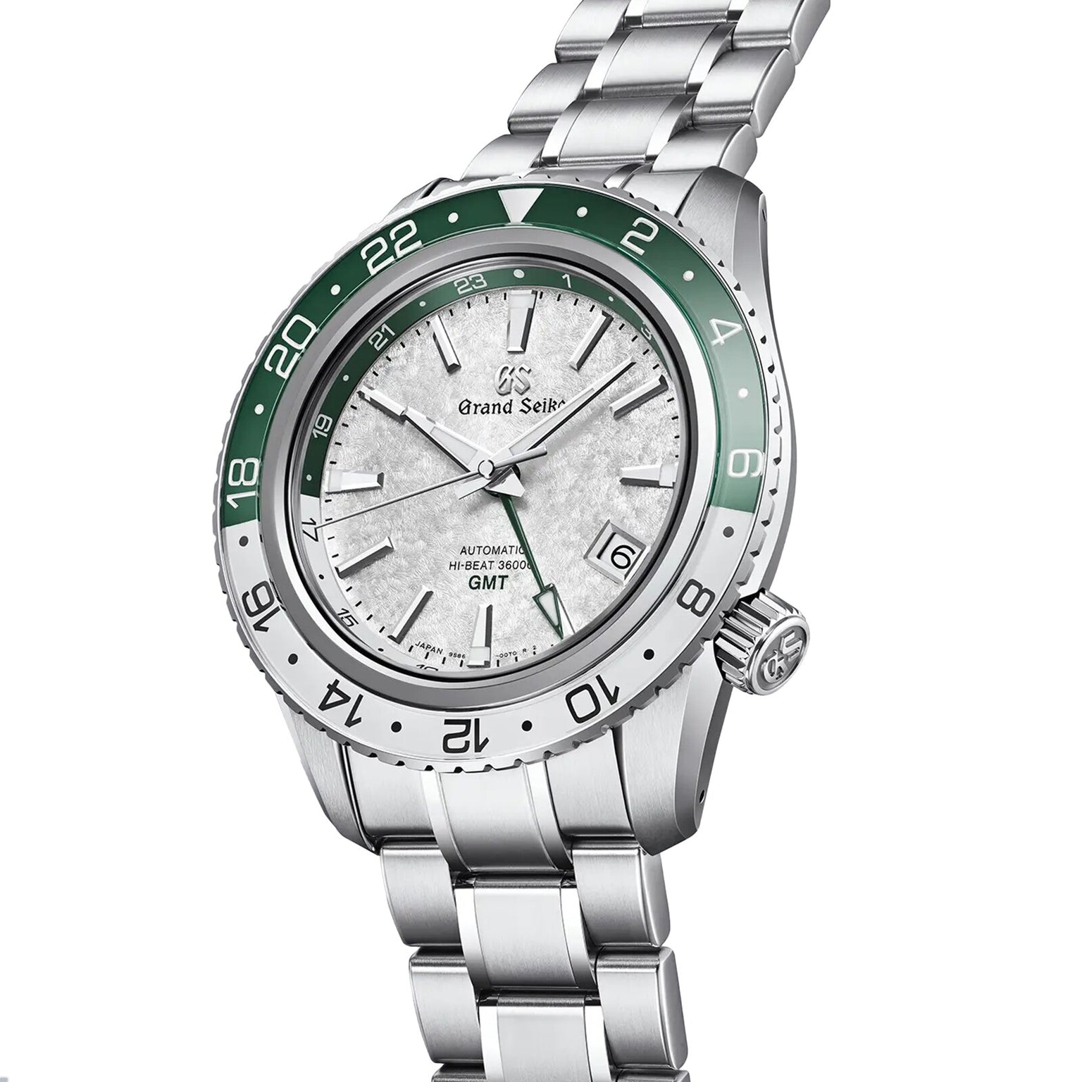 The Grand Seiko Hi-Beat GMT Sport is a stainless steel wristwatch with a green and white GMT bezel, silver textured dial with GMT functionality, date at 3 oclock, and a robust metal bracelet.