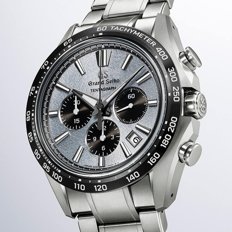 The Grand Seiko Hi-Beat 36000 Automatic Chronograph Evolution 9 SLGC007 is a stainless steel watch featuring a textured silver dial, three subdials, tachymeter bezel, and metal bracelet.