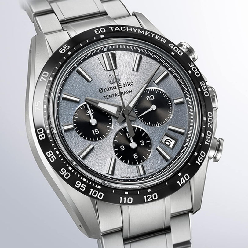 The Grand Seiko Hi-Beat 36000 Automatic Chronograph Evolution 9 SLGC007 features a stainless steel case, textured grey dial, three subdials, date display, and tachymeter bezel, powered by Caliber 9SC5.