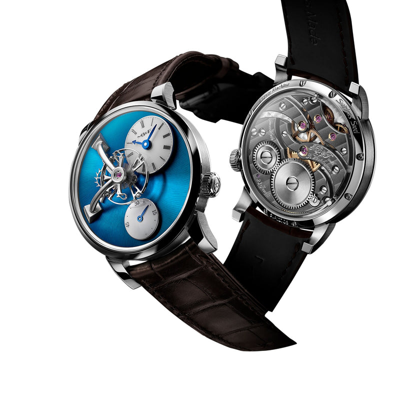 The MB&F Legacy Machine LM101 Steel Blue features a stunning blue dial, while another model highlights its intricate mechanical movement.