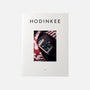 HODINKEE Magazine, Volume 9 by Hodinkee features a wristwatch photo on its white cover, celebrating horology against a red and white patterned background.