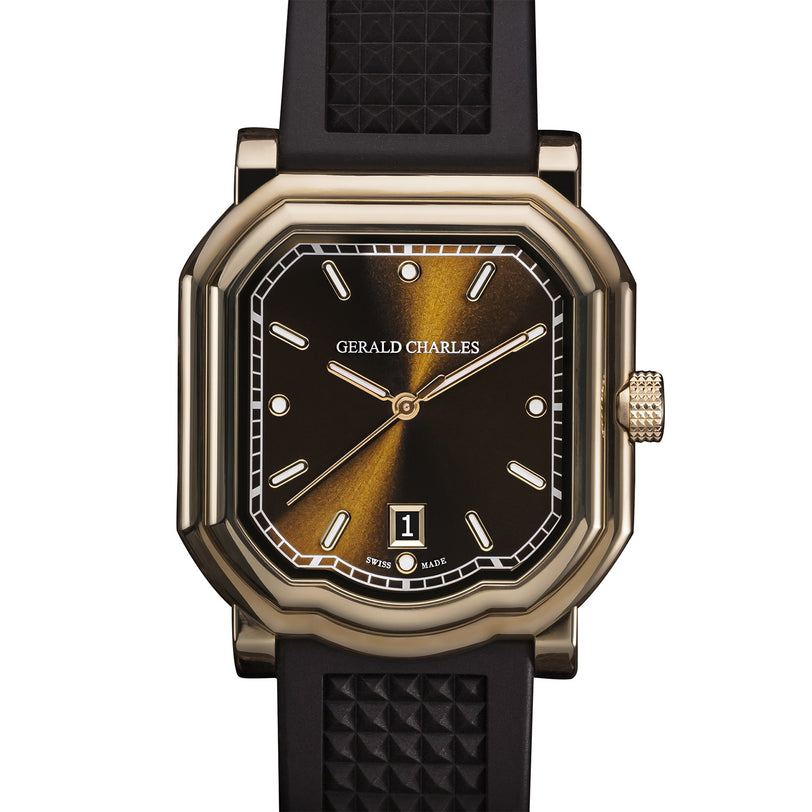 The Gerald Charles Maestro 2.0 Ultra-Thin is a luxury wristwatch featuring a black and gold dial, date display, and a black textured strap.