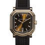 The Gerald Charles Maestro 2.0 Ultra-Thin is a luxury wristwatch featuring a black and gold dial, date display, and a black textured strap.