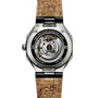 Back view of the ID Geneve Circular 1 - Mineral Black watch with a cork strap, exposed gears, and 100% Recycled Stainless Steel engraved.