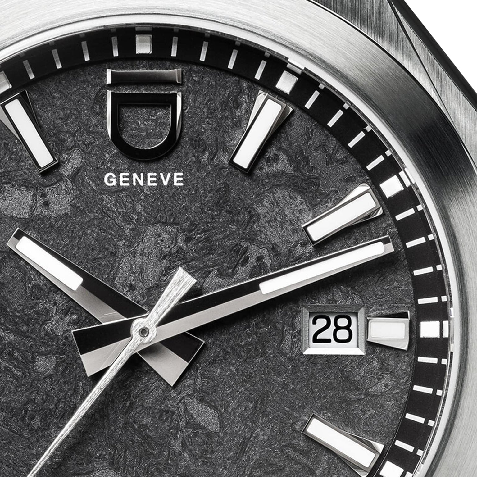 Close-up of the ID Geneve Circular 1 - Mineral Black watch face, featuring silver markers, textured black dial, and date window displaying 28.