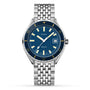 The DOXA Sub 200 Caribbean is a divers watch made of 316L stainless steel, with a blue dial, silver hour markers, unidirectional rotating bezel, 3 o’clock date display, metal link bracelet, and “DOXA SUB 200” on the face.