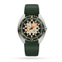 The DOXA Army Bronze wristwatch features a green band, bronze uni-directional bezel, beige and black dial, orange hour and minute hands, date at 3 o’clock, and “DOXA Army automatic” on the face.