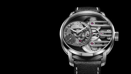 Luxury skeleton watch with visible gears and black leather strap on a black background.