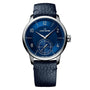 The Louis Erard Petite Seconde Bleu Nuit wristwatch features a blue dial, blue leather strap, silver case, and a minimalist design.