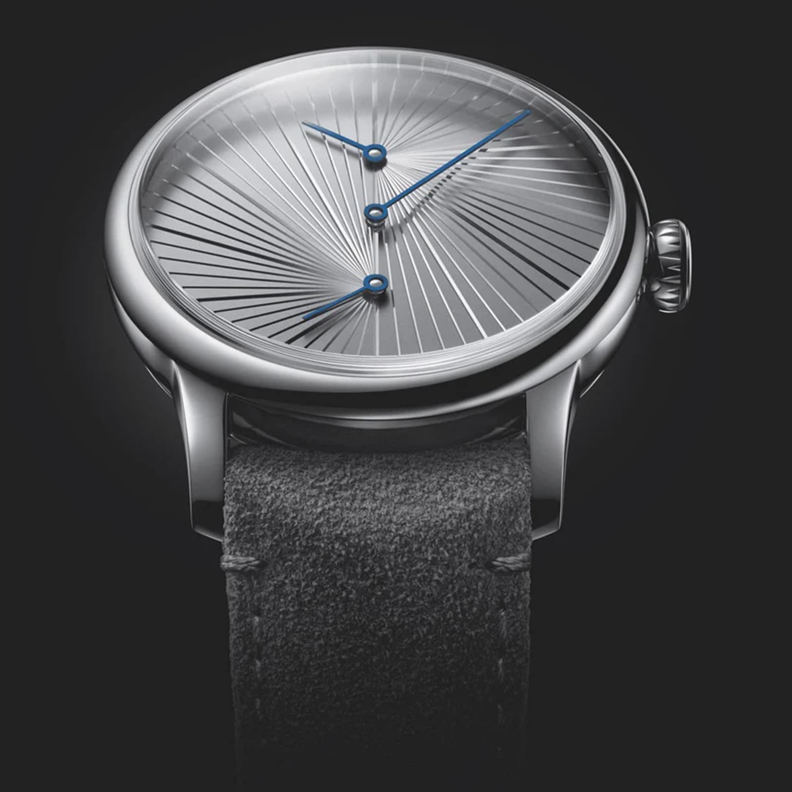 The Louis Erard Le Régulateur, created with atelier oï, features a silver dial with a radiating texture, blue hands, and a black leather strap, showcased against a dark backdrop.