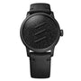 The Le Régulateur Louis Erard x Olivier Mosset by Louis Erard is a black wristwatch featuring a textured, sparkling dial with three diagonal raised lines, paired with a black leather strap.