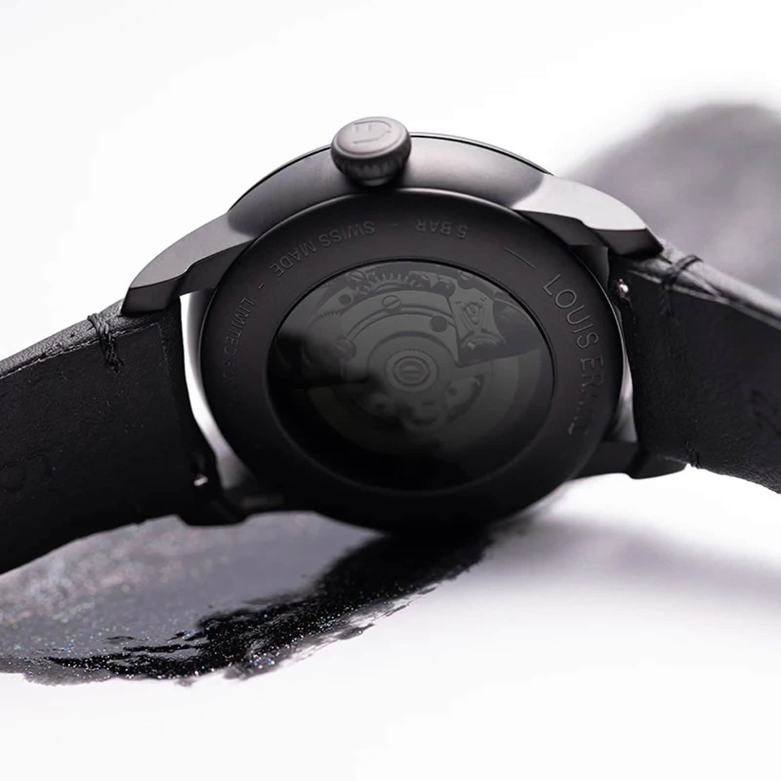 Close-up of the back of the Louis Erard Le Régulateur Louis Erard x Olivier Mosset wristwatch, showing its visible inner mechanism and black leather strap.