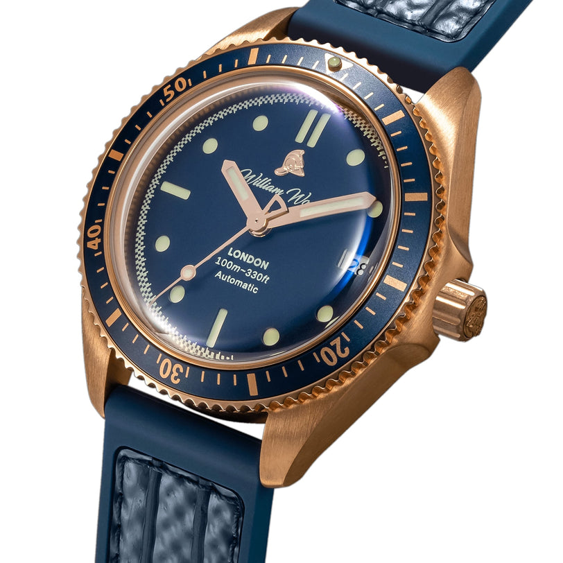 The William Wood Valiant Collection - Bronze Sapphire wristwatch features a textured strap and luminous markers, displayed at 10:11.