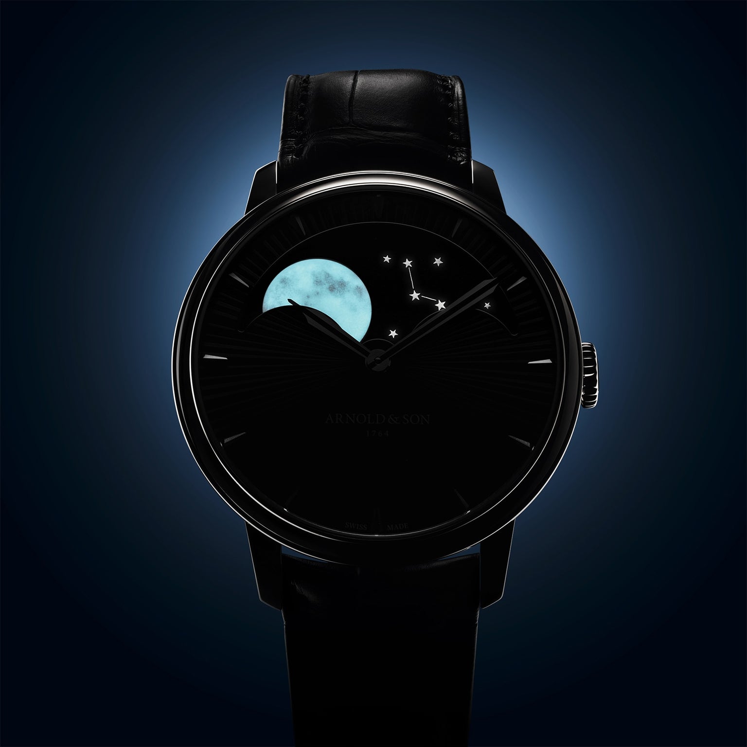 The Arnold & Son Perpetual Moon 41.5mm Platinum features a minimalist dark face with moon phase and constellation design, paired with a black leather strap for a luxurious look.