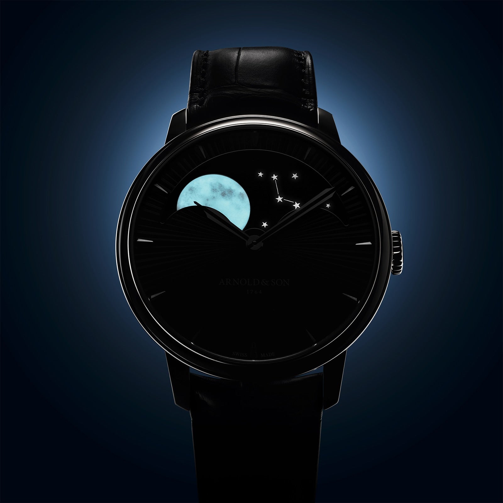 The Arnold & Son Perpetual Moon 41.5mm Platinum features a minimalist dark face with moon phase and constellation design, paired with a black leather strap for a luxurious look.