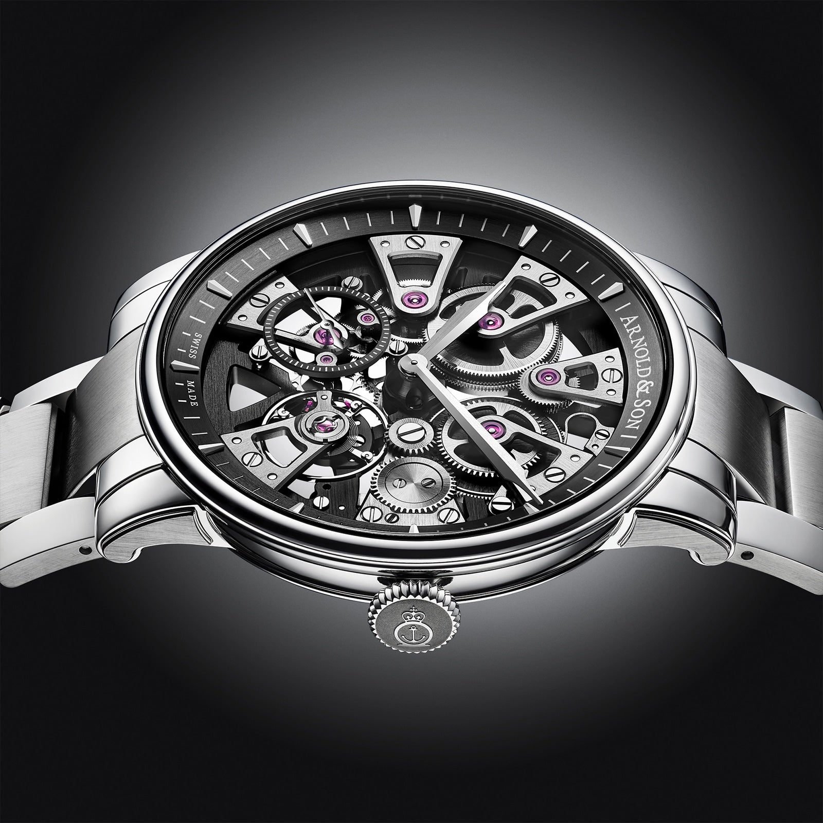 The Arnold & Son Nebula 41.5 Steel is a luxury skeleton watch with exposed gears and mechanisms, featuring a stainless steel bracelet and black accents.