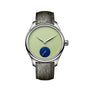 Wristwatch with green dial and gray leather strap on white background