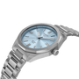 Silver Tissot watch with a blue face on a white background