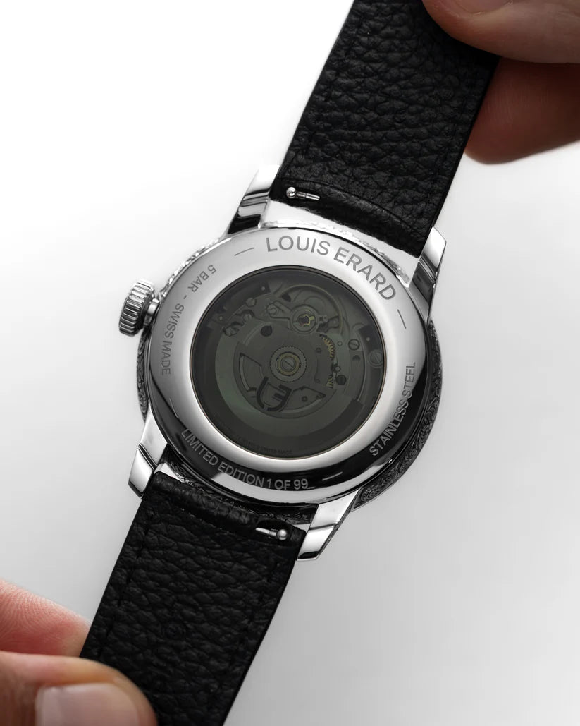 Close-up of a Louis Erard watch with a black leather strap on a white background