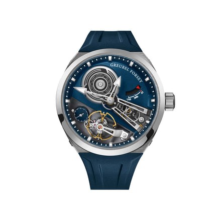 Titanium watch with blue dial, visible mechanical movement, dark blue rubber strap, and subsidiary dials.