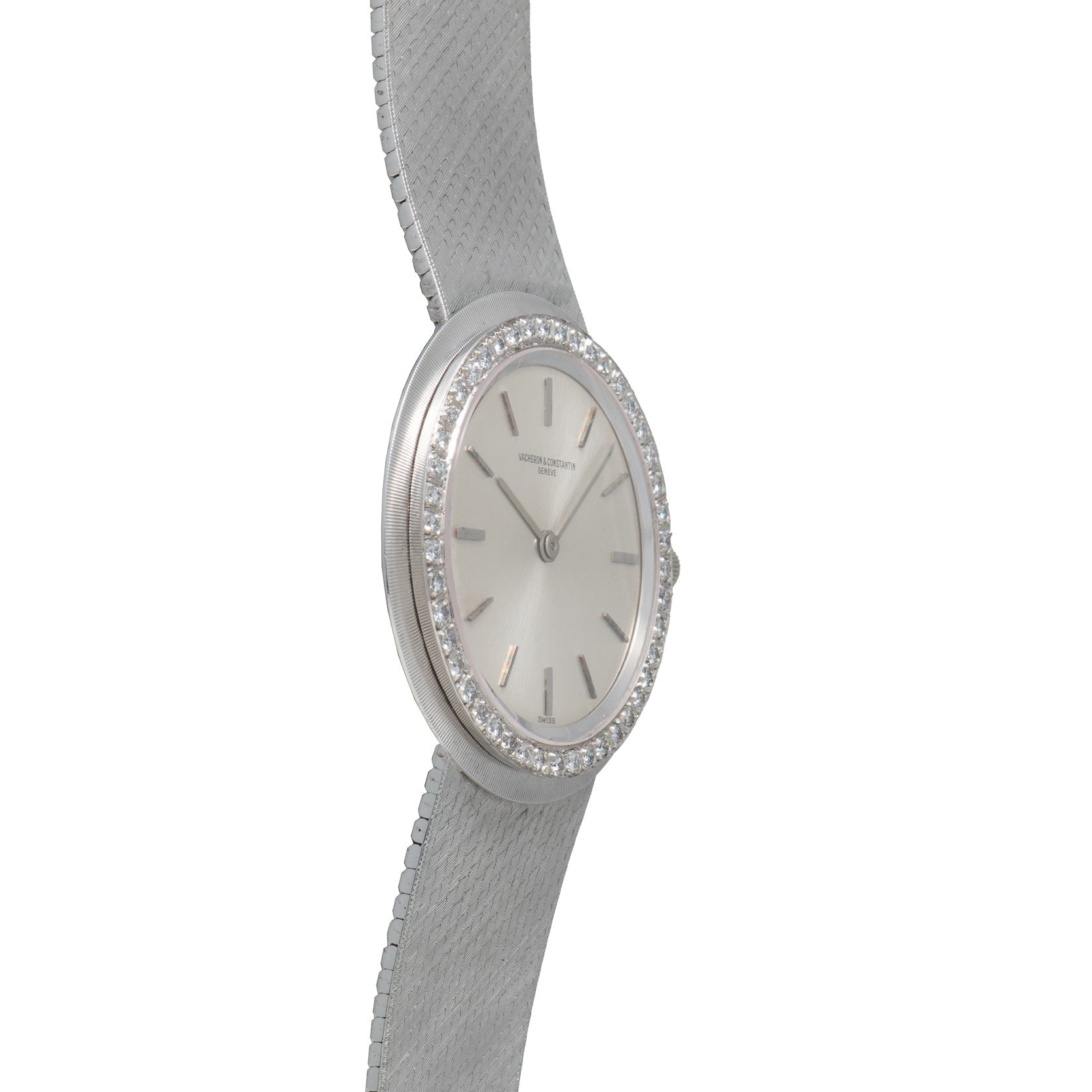 A Vacheron Constantin White Gold Diamond Bezel wristwatch with a textured metal band displayed on a white background.
