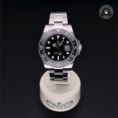 Rolex Certified Pre-owned GMT M116710LN-0001 front on black background